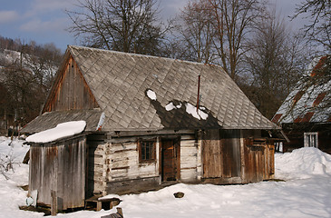 Image showing Small wooden house in a village