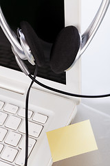 Image showing headset keyboard notebook laptop in office on table desk