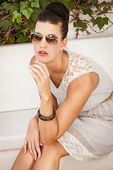 Image showing attractive brunette woman with sunglasses and red lips 