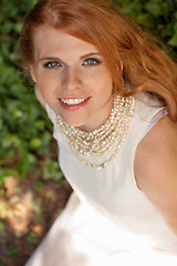 Image showing beautiful smiling young redhead woman portrait outdoor