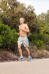 Image showing athletic man runner jogging in nature outdoor