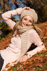 Image showing young smiling woman with hat and scarf outdoor in autumn