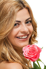 Image showing attractive young smiling woman with flowers roses isolated