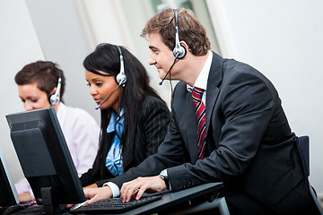 Image showing smiling callcenter agent with headset support