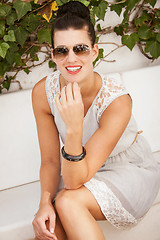Image showing attractive brunette woman with sunglasses and red lips 