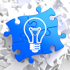 Image showing Light Bulb Icon on Blue Puzzle.