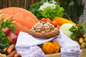 Image showing Beautiful cake on a white towel, vegetables, fruits.