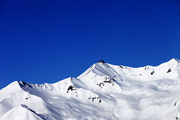 Image showing Off-piste slope and blue clear sky in nice winter day