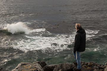 Image showing Man watching the ocean waves