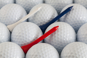 Image showing Golf balls and wooden tees