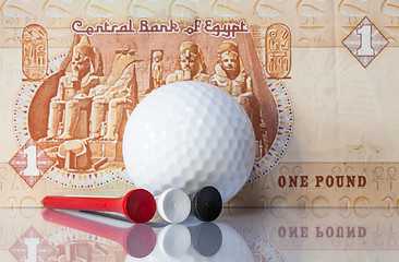 Image showing Egyptian money and golf equipments