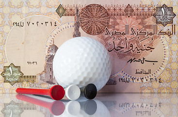 Image showing Egyptian money and golf equipments