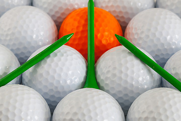 Image showing Golf balls and wooden tees