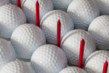 Image showing Golf balls and wooden tees in open box