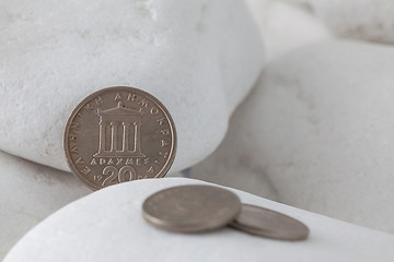 Image showing Greek drachma coins on a white stones