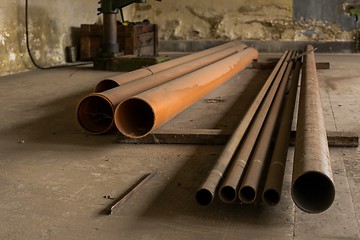 Image showing Piled Old, rusty, dirty pipes