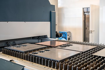 Image showing Machine cutting steel in a factory