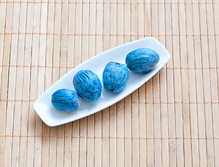 Image showing dish of nuts on a bamboo napkin