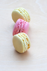 Image showing Colorful macaroons on wooden background