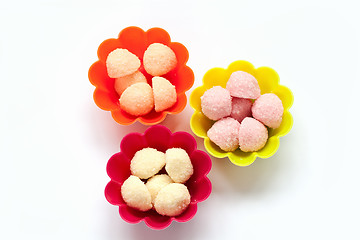 Image showing sweet jelly candies in cup cake cases on white