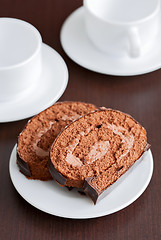 Image showing two slices of tasty chocolate cake on a plate