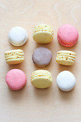 Image showing colored macaron on wooden background