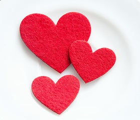 Image showing Red hearts on a plate close-up. Valentine's Day