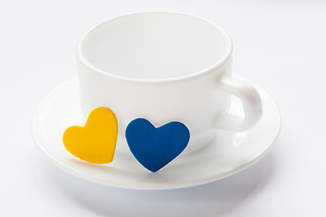 Image showing empty cup and saucer with hearts