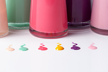 Image showing Bottles with spilled nail polish