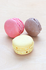 Image showing colored macaron on wooden background