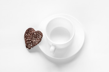 Image showing cup and saucer and a chocolate coconut cookies