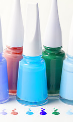 Image showing Bottles with spilled nail polish