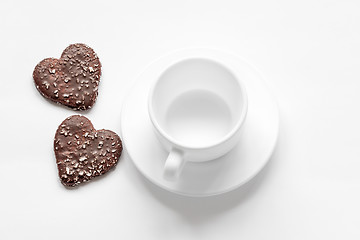 Image showing cup and saucer and a chocolate coconut cookies