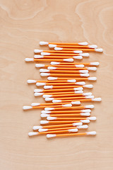 Image showing Ear sticks scattered on a table