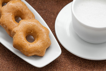 Image showing honey cookies on a plate and a cup of milk