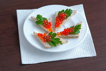 Image showing Sandwiches with red caviar and parsley