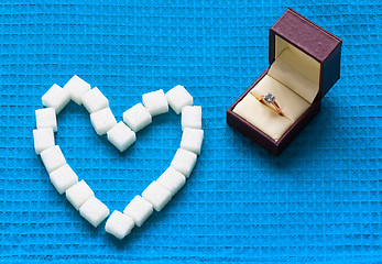 Image showing engagement ring and sugar hearts