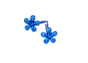 Image showing blue earrings in the shape of flowers on a white