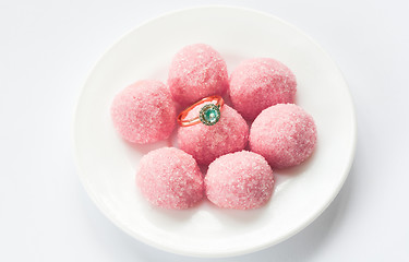 Image showing pink marmalade and engagement ring