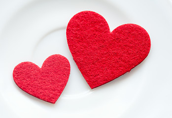 Image showing Red hearts on a plate close-up. Valentine's Day