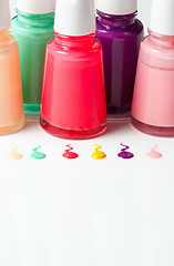 Image showing Bottles with spilled nail polish