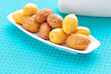 Image showing large nuts on a plate