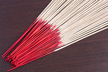 Image showing Incense aromatic sticks on the wooden background