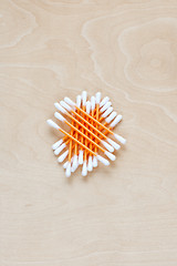 Image showing Ear sticks scattered on a table