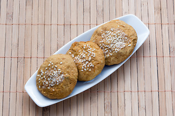 Image showing sweet cakes with sesame seeds on a plate