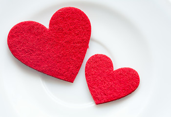 Image showing Red hearts on a plate close-up. Valentine's Day