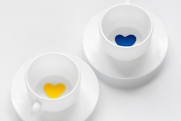 Image showing empty cup and saucer with hearts