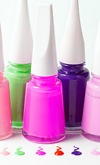 Image showing Bottles with spilled nail polish