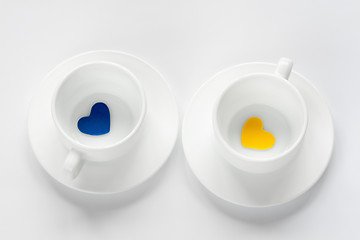 Image showing empty cup and saucer with hearts