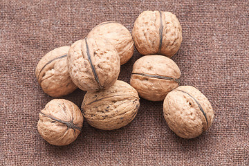 Image showing walnuts close up on the burlap background
